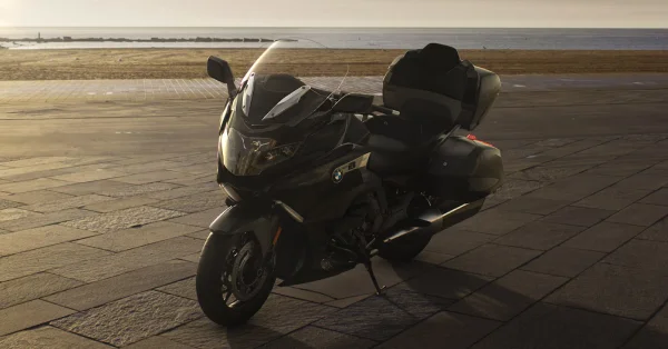 2026 BMW K 1600 Grand America touring motorcycle riding along a coastal road